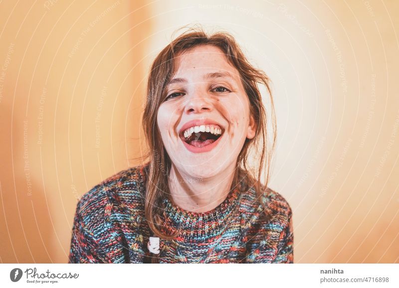 Emotional portrait of a real woman laughing happy happiness joy enjoy natural looking self-confidence true joyful cheerful people young woman young adult cool
