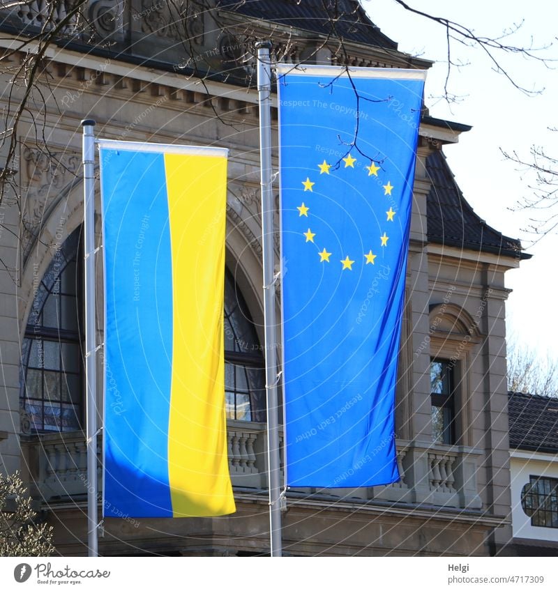 Solidarity - flag of Europe and Ukraine in front of a building European flag Building Flagpole Light Shadow Sunlight Stand Blow Politics and state Ensign