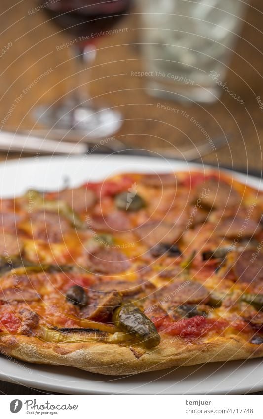 Close up of pizza with wine on wood Pizza Plate Wood Rustic Glass Vine Delicious pizzeria background Close-up Eating Kitchen Mozzarella Slice Red Cheese Meal
