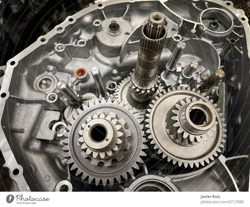 gearbox of an open engine with sprockets, shafts, gearwheels, transmission of a combustion engine, car parts, mechanics mechanical automotive machinery power