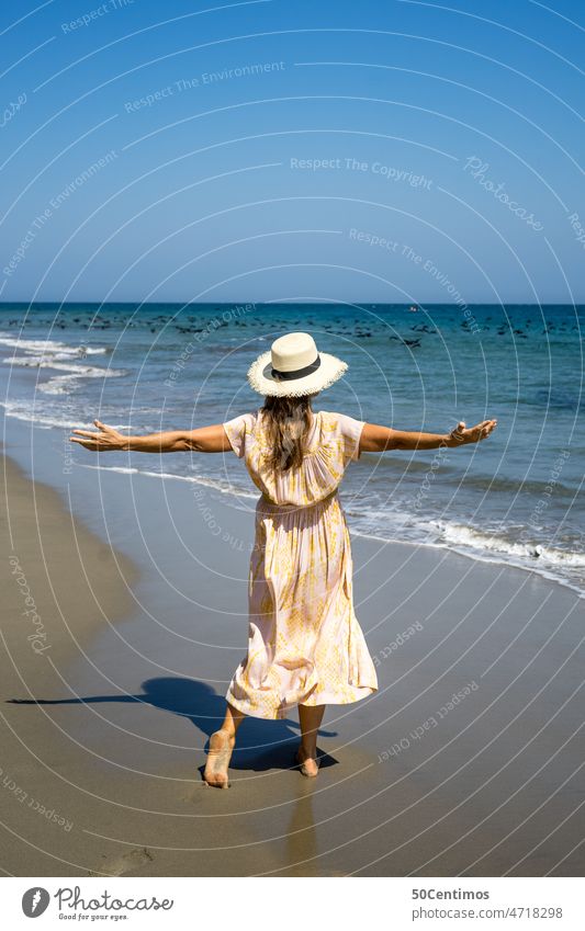 Vacation by the sea Ocean Woman Summer Beach vacation pretty Joy Freedom Vacation & Travel Water Sand Sky Exterior shot Tourism Summer vacation Far-off places