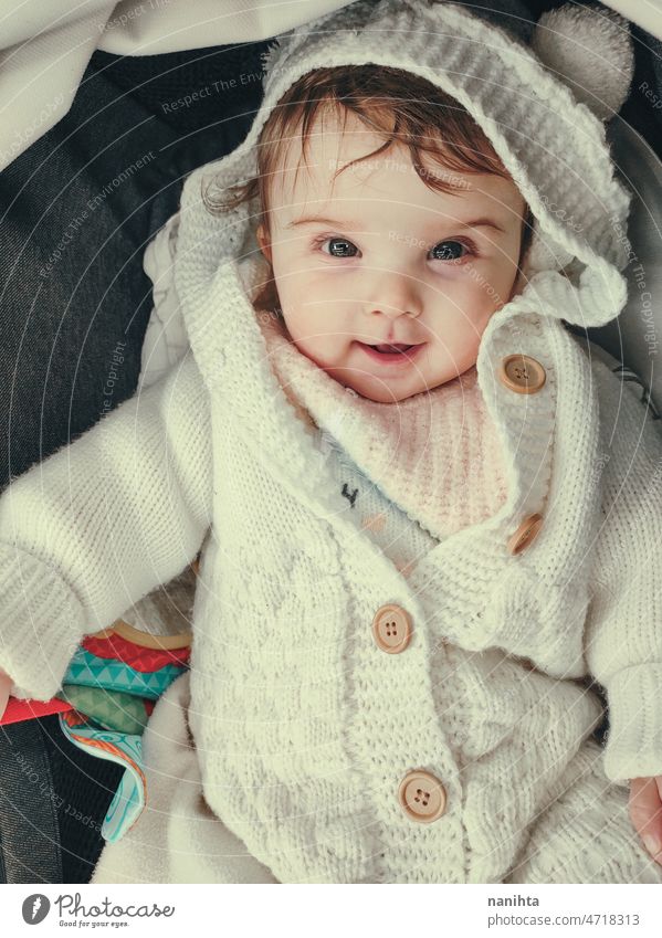 Lovely little girl wearing a bear woolen coat baby cute adorable portrait lovely hood hoodie fashion warm winter cozy clothes baby girl teddy bear soft playful