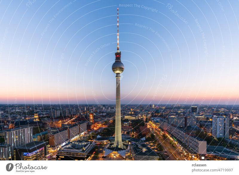 Aerial view of Berlin skyline with famous TV tower at Alexanderplatz and dramatic clouds in twilight during blue hour at dusk, Germany berlin germany tv