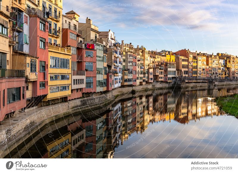 Serene canal in old city district with aged buildings channel facade cityscape town house coast exterior shore residential neighborhood settlement property