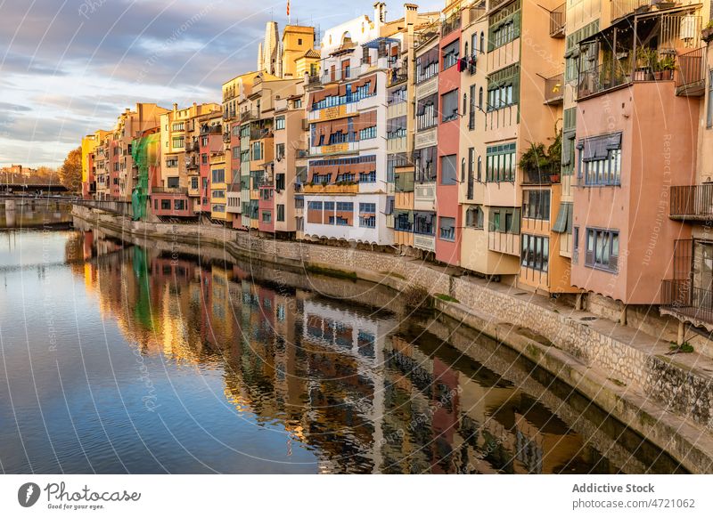 Serene canal in old city district with aged buildings channel facade cityscape town house coast exterior shore residential neighborhood settlement property