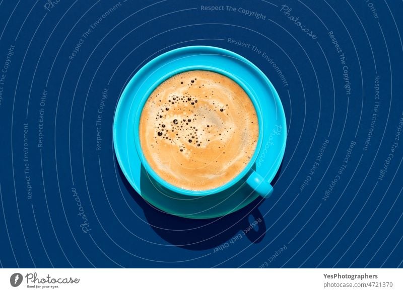 Cup of coffee above view on a blue background. Hot coffee in a blue mug. americano arabica aroma beverage black break breakfast brown cafe caffeine cappuccino