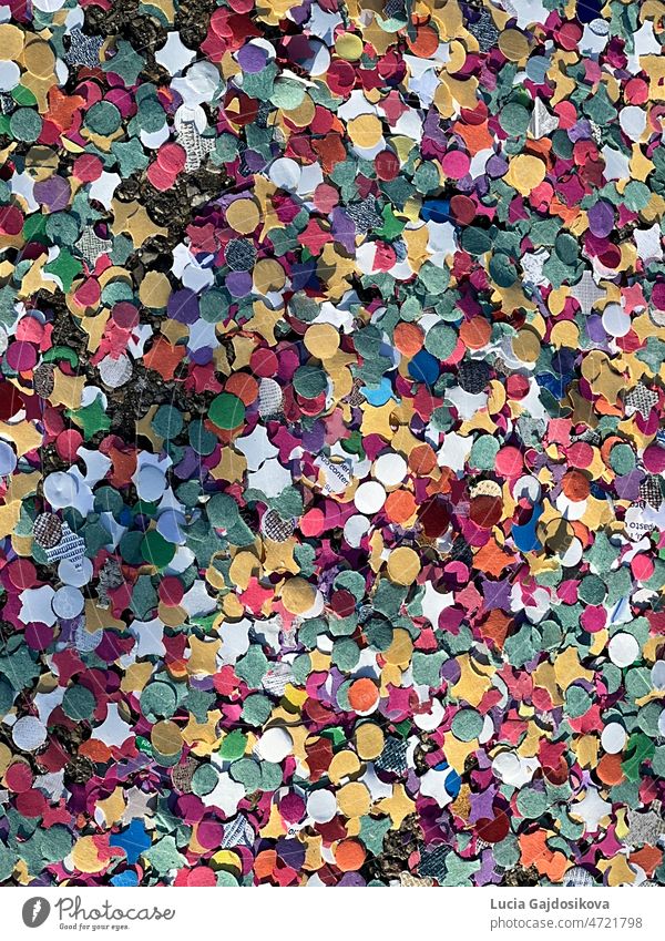 Confetti spread on the ground at carnival time. There are colorful and can be used as seasonal background with copy space. confetti multicolor holiday europe