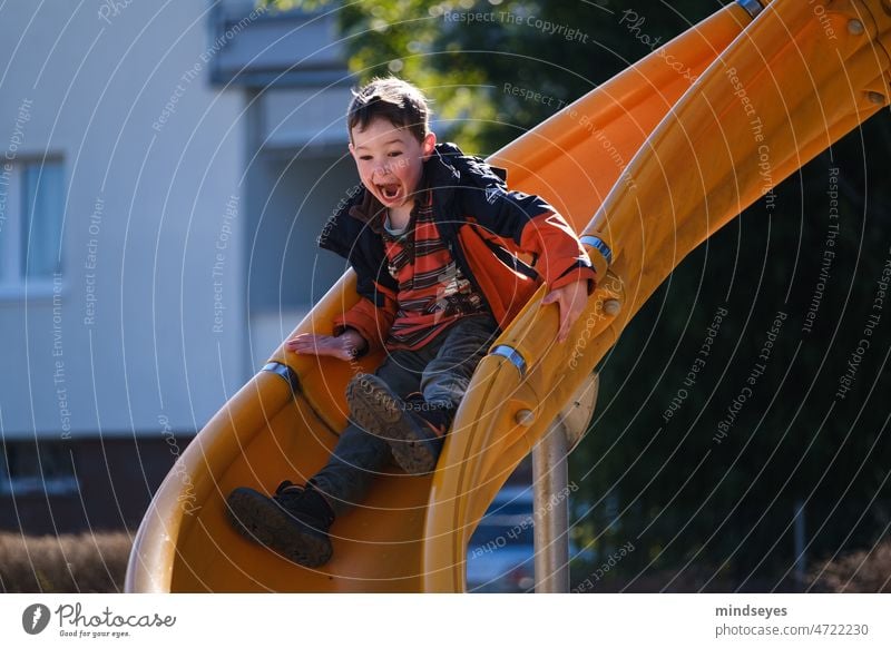Fun on the playground Playground Slide Joy fun effusively Infancy Boy (child) Speed Playing Child Exterior shot Leisure and hobbies Happiness Movement