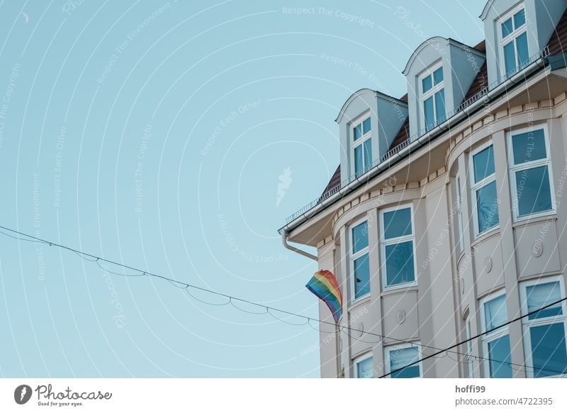 Rainbow flag flying lonely on a house rainbow flag pride Acceptance Homosexual concept symbol Hope Tolerant Flag Society LGBT Relationship Sexuality