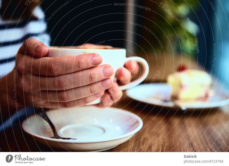 Woman have breakfast at cafe, hold coffee cap in hands coffee break cake food morning woman window cheesecake adult business caucasian drink cup device female