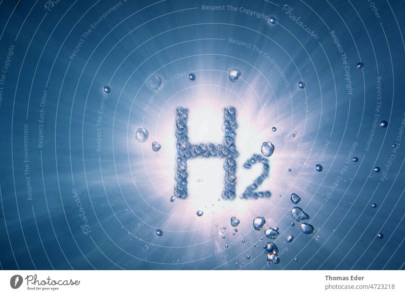 letters hydrogen h2 with lot of bubbles in a blue water with sun H2 energy environment science technology chemistry Renewable innovation electricity concept
