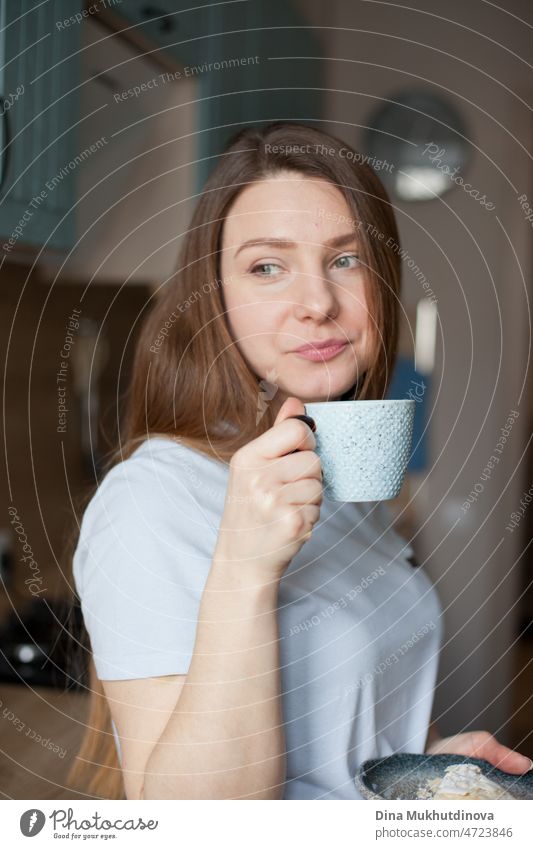 young woman at home drinking coffee in the morning from ceramic cup, smiling to new day good morming candid real people lifestyle Drinking Coffee fresh