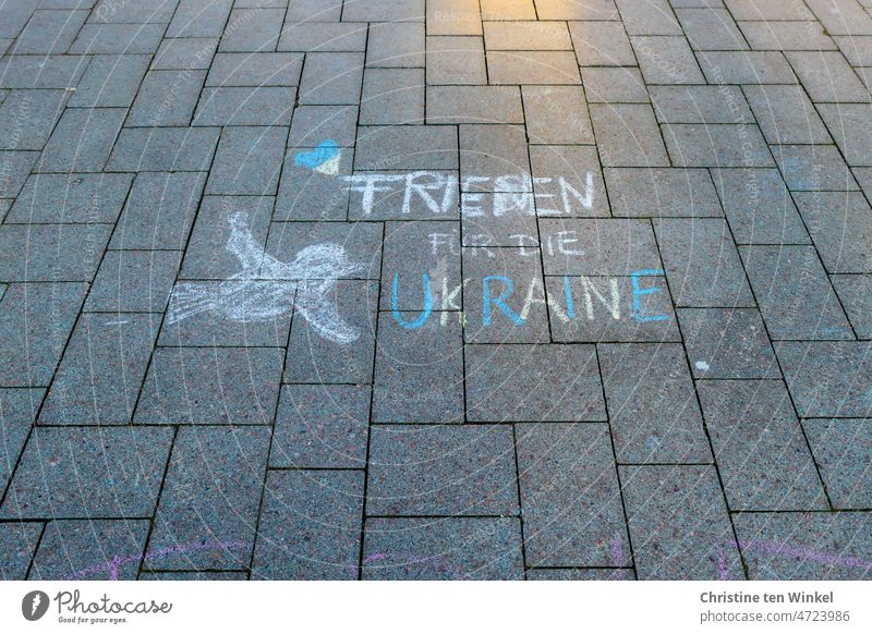 "Peace for Ukraine" , a heart and a dove of peace. Painted on the marketplace with street crayon. Peace Declaration peace offer Characters Graffiti Hope