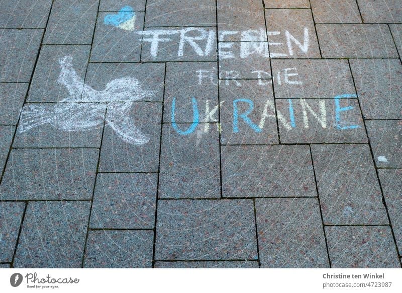 "Peace for Ukraine" , a heart and a dove of peace. Painted on the marketplace with street crayon. Peace Declaration peace offer Characters Graffiti Hope