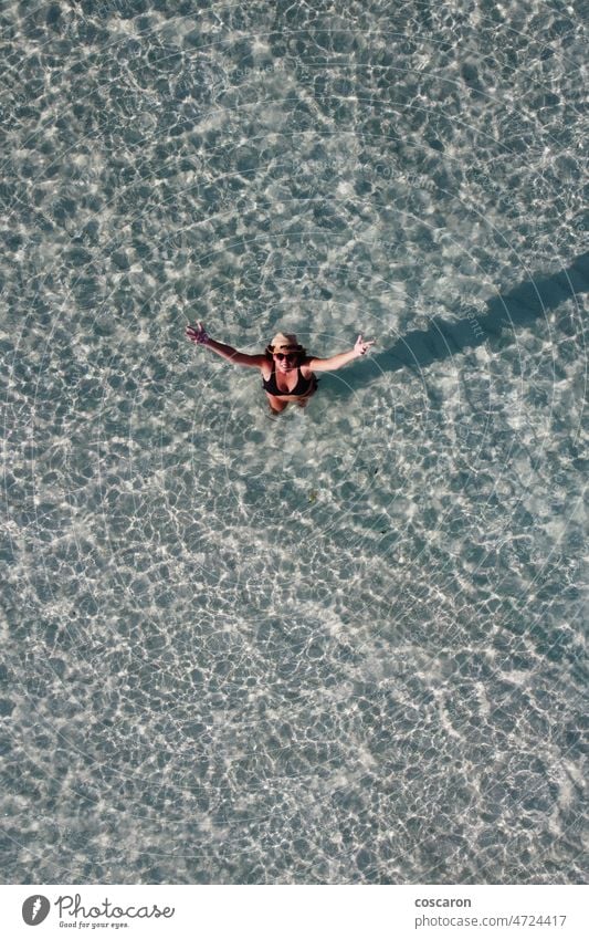 Attractive woman greetings from water. Aerial view. above aerial aerial view background beach beautiful bikini blue board cancun caribbean clear coast