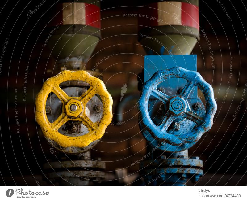 Stopcocks , gate valves for gas or oil pipelines in the national colors of Ukraine blue - yellow Ukraine war Trade embargo Gas Cooking oil Gas supply