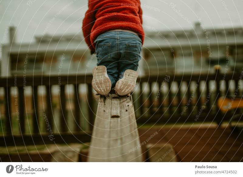 Child on playground childhood Rear view Unrecognizable Playground shoes Footwear Childhood memory Playing Lifestyle Joy Human being Colour photo Day