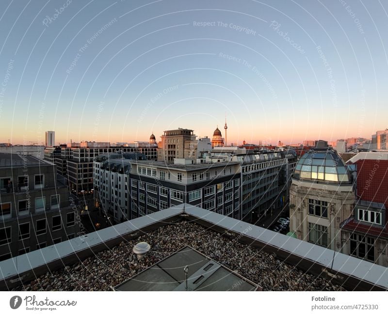 Above the rooftops of Berlin, the horizon already turns slightly reddish in the evening sunset. Architecture Town Downtown Berlin Capital city City