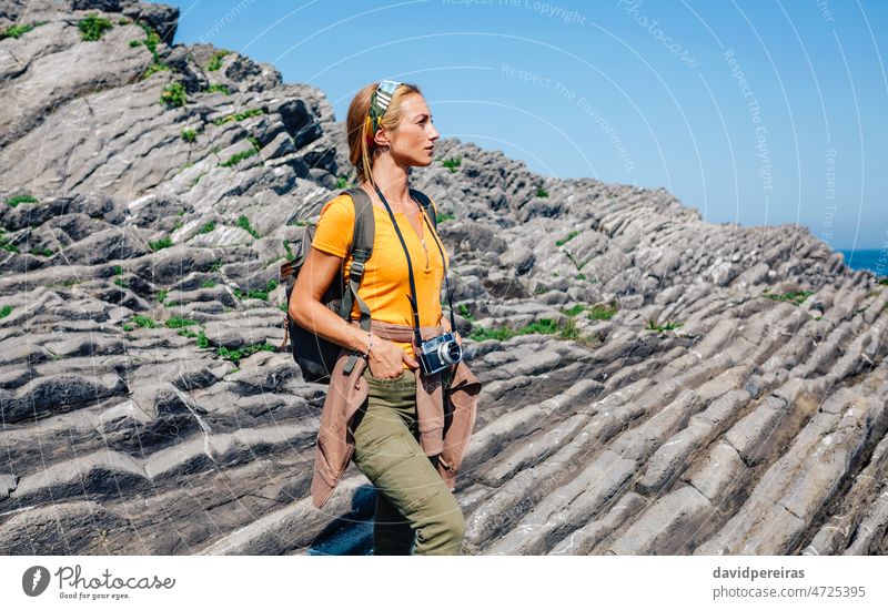 Hiking woman watching flysch rocks landscape young hiking backpack copy space excursion trekking portrait one person exercising trip explore weekend discovery