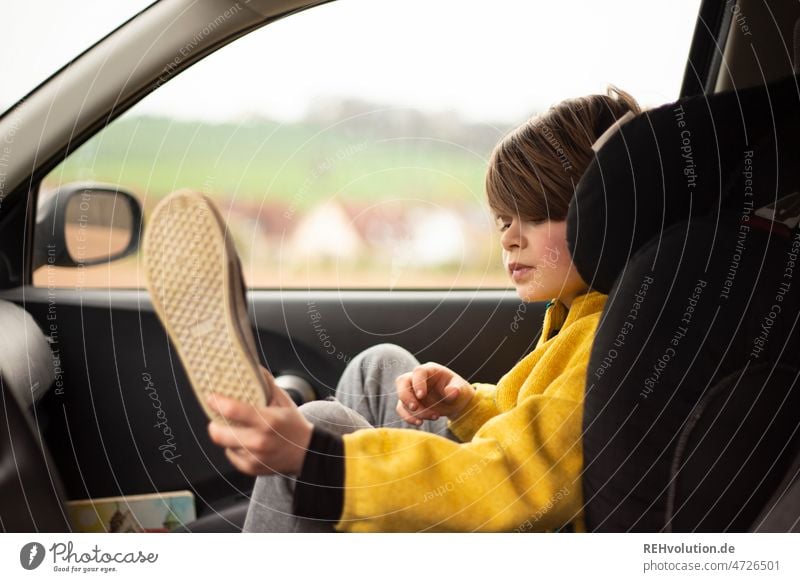 Child sitting in car Motoring Transport Infancy Safety Mobility mobile In transit Child seat sure Driving portrait Trip Yellow 7 years Means of transport Car