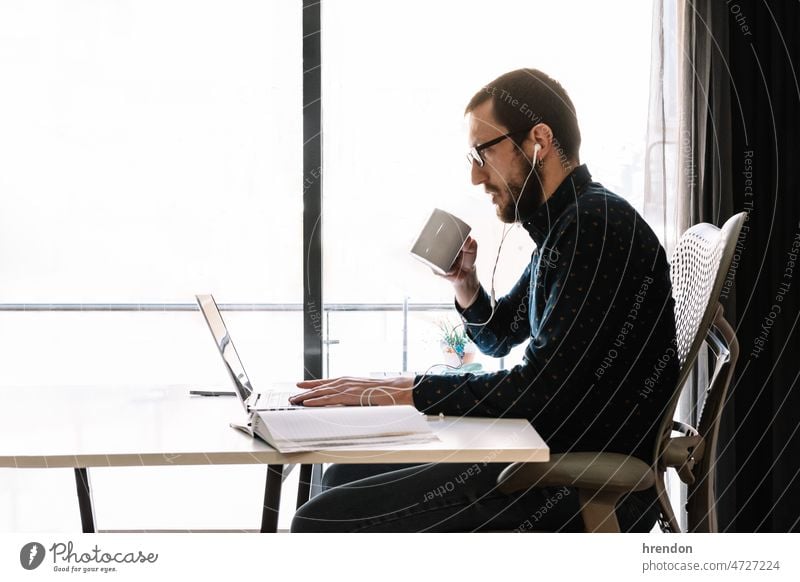 Man working at home home office young adult worker lifestyles small business businessman laptop desk computer technology business person domestic life