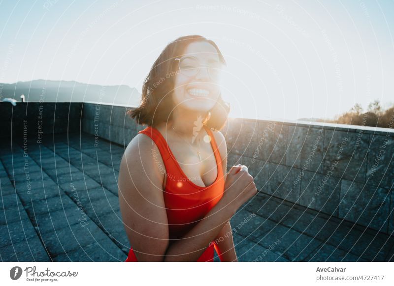 Portrait of young woman on sport clothes after a workout training outdoors, happy lifestyle sport. Portrait of happy fit people. Sport people workout concept during sunset