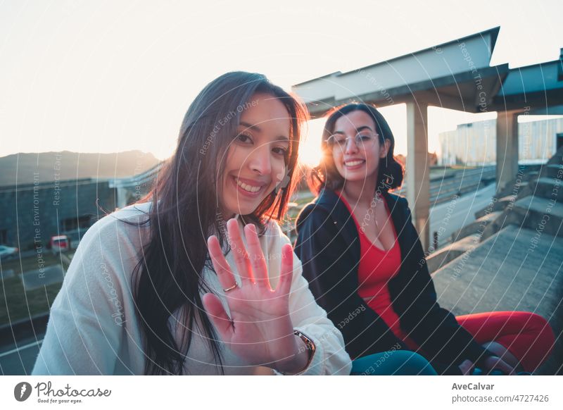 Two young woman on sport clothes having fun after a workout training outdoors, happy lifestyle sport. Portrait of happy fit people, friends exercising together. Sport people workout concept
