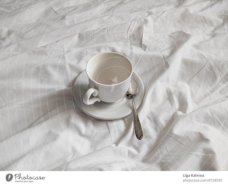 White cup on white plate on white bed spread Cup Plate Breakfast Coffee Beverage To have a coffee To enjoy Drinking Coffee mug Close-up Hot drink Food
