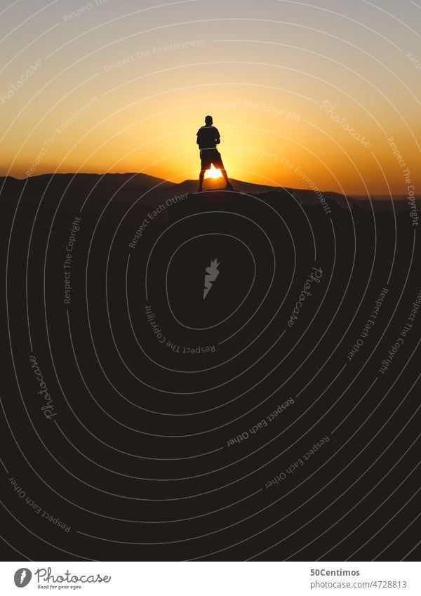 Silhouettes of hiker at sunset To go for a walk Trip Exterior shot Landscape Sky Back-light Beautiful weather Sun Desert mountains Colour photo from behind