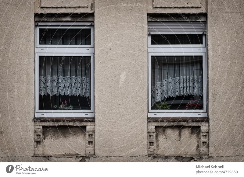 Two windows with old fashioned curtains House (Residential Structure) old house Architecture Building Facade Window Past Transience Decline Wall (barrier)