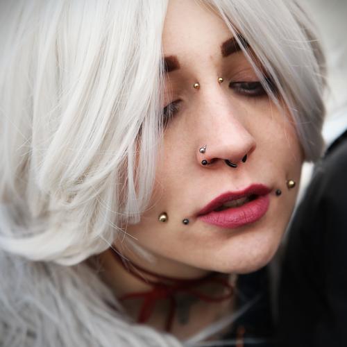 Woman with piercings Feminine White-haired Hair and hairstyles Piercing Exceptional Moody Emotions Inspiration Creativity portrait Downward devotion Meditative
