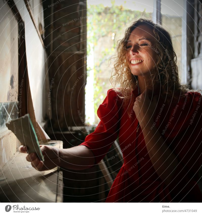 Woman with mirror Mirror lost places Dress Red longhaarug Blonde Laughter perforate reflection light source daylight sunny