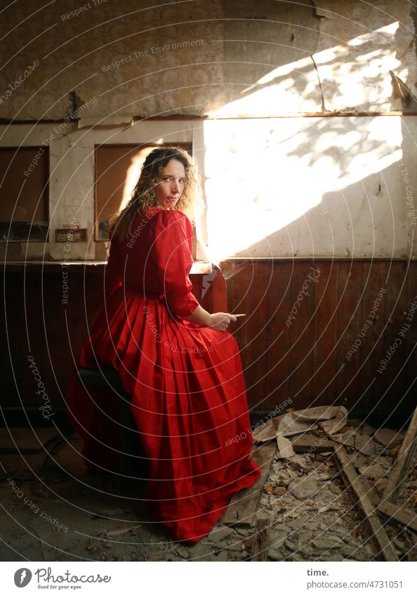 Woman in red dress Dress Red lost places Blonde Long-haired Sunlight Room room Sit look of the shoulder rubbish Broken