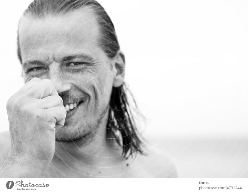 smiling man by the sea Man portrait Smiling wet hair Hand Looking into the camera pit masculine facing Congenial Designer stubble Sky Horizon Masculine Laughter