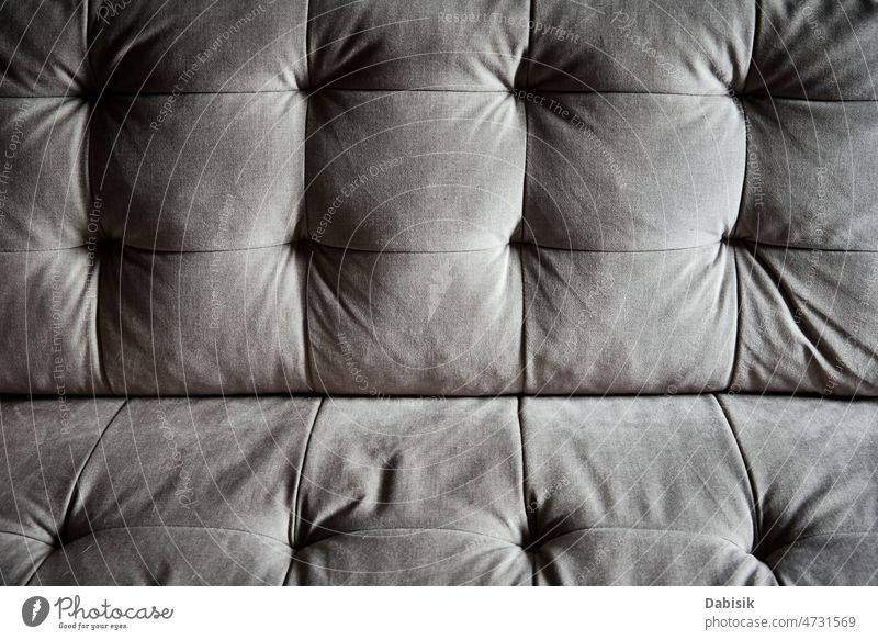 Close up detail of couch sofa surface pattern background button furniture gray fabric comfortable textile velvet seat luxury color interior indoors classic cozy