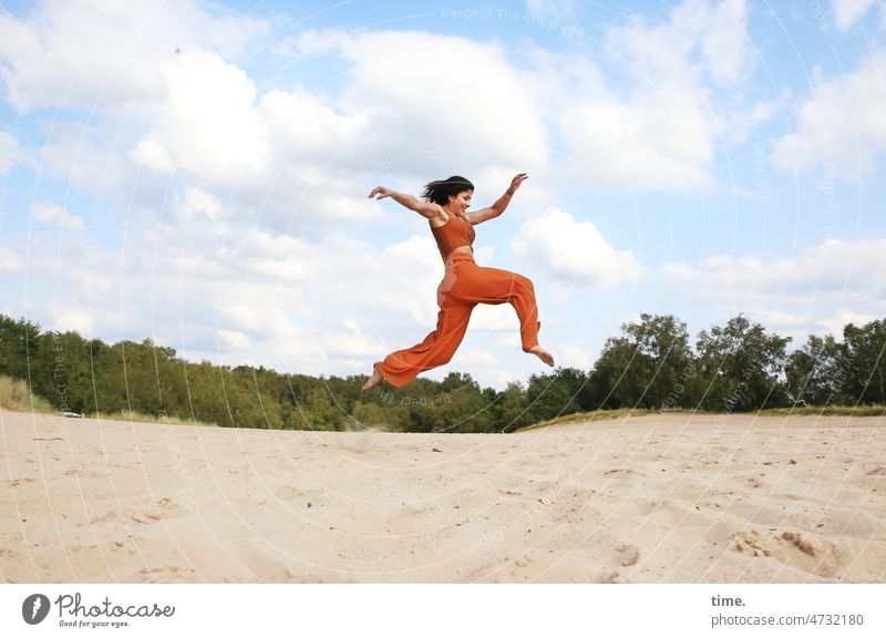 Happiness over sand Woman Jump Sand Landscape Sky Joy Athletic Clouds Summer Movement Happy Freedom Joie de vivre (Vitality) Horizon Edge of the forest jump