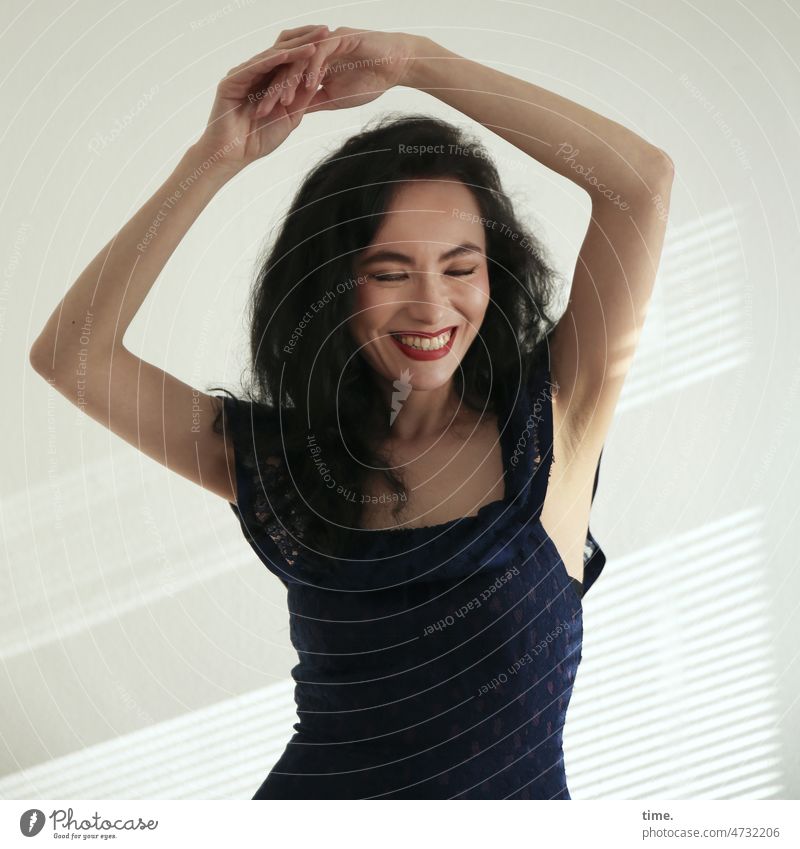 dancing woman Woman Elegant Dress Dark-haired portrait Long-haired Curl Strip of light Shadow sunny Sunlight Closed eyes Laughter fortunate contented relaxed