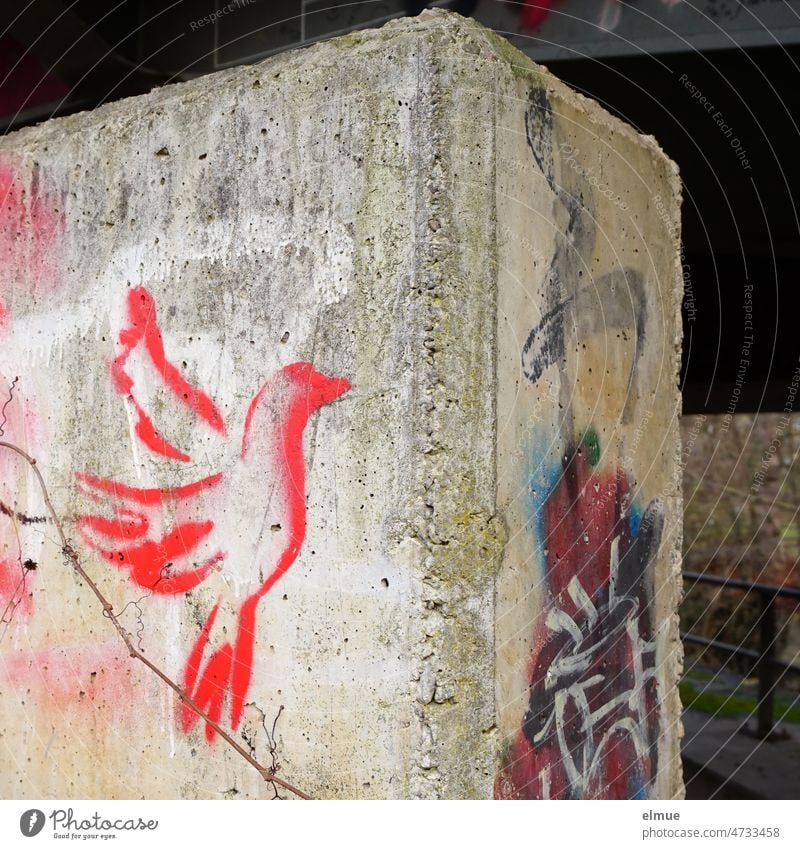 sprayed red peace dove on a concrete pillar / graffiti / solidarity / Ukraine war Dove of peace Red Blood Red War Solidarity Hope Politics and state