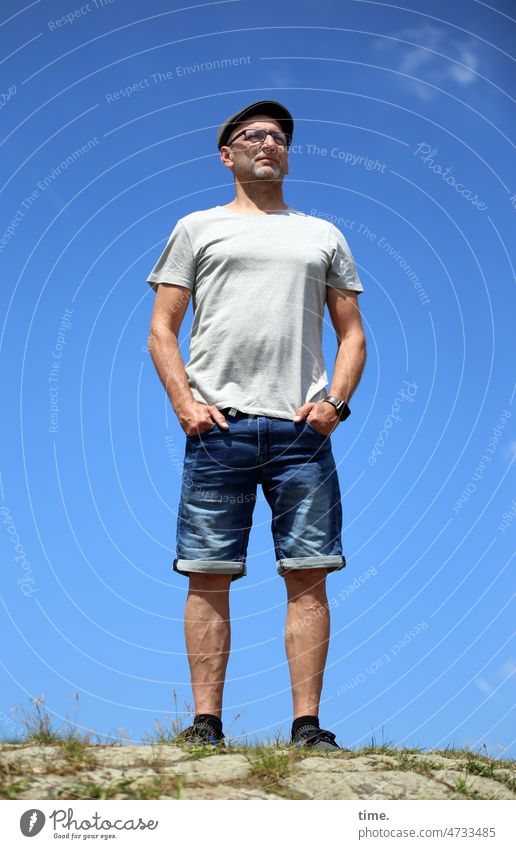 Remote viewer Man Cap Eyeglasses Sky T-shirt look Stand sunny Hill Summer warm determined keep an eye out