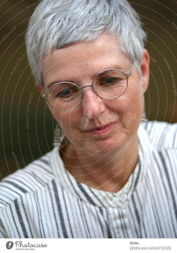 Woman in mind Eyeglasses Feminine Gray-haired Short-haired Shirt Downward hollowed submerged in thought Dream Smiling contented tranquillity silent