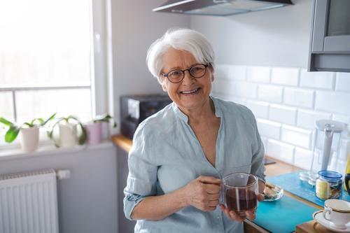 Shot of a senior woman in her kitchen alone at home domestic life elderly female grandma grandmother grey hair house indoors lifestyle mature old older