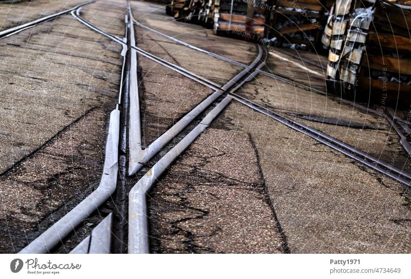 Railroad tracks on a factory site form an X rails Rail transport Industry Logistics Transport Railroad system Traffic infrastructure Exterior shot Deserted