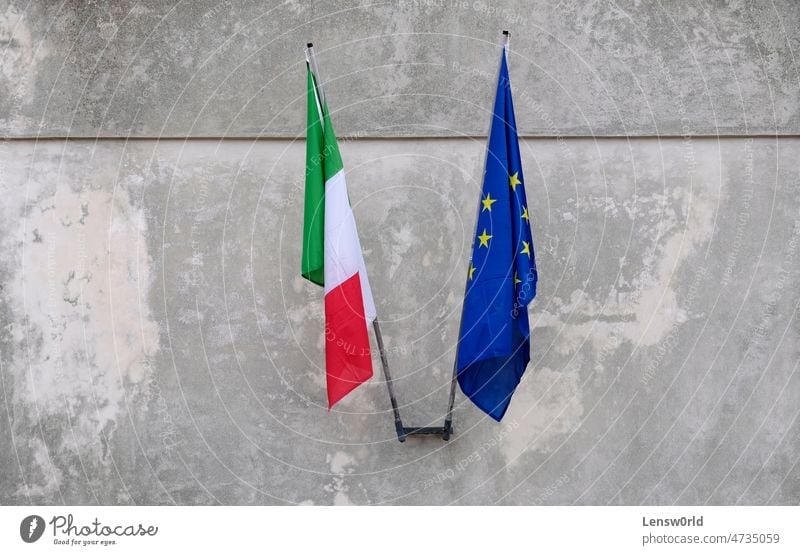 The flags of Italy and the EU motionless without wind at a building bari blue collaboration culture eu europe european european union italian italy nation