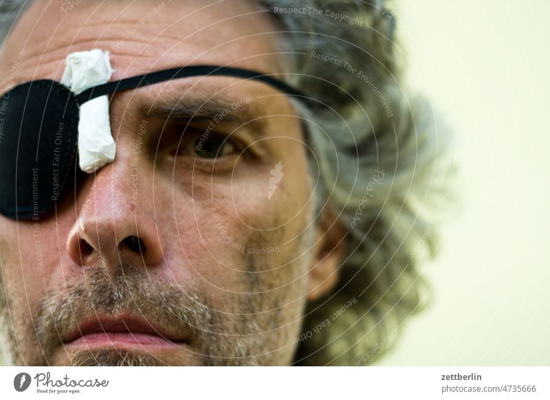 Portrait with eye patch Eyes Facial hair adult Face Head Man Nose portrait skepticism look at Observe Looking view see peep peek Caught Surprise Eyeglasses