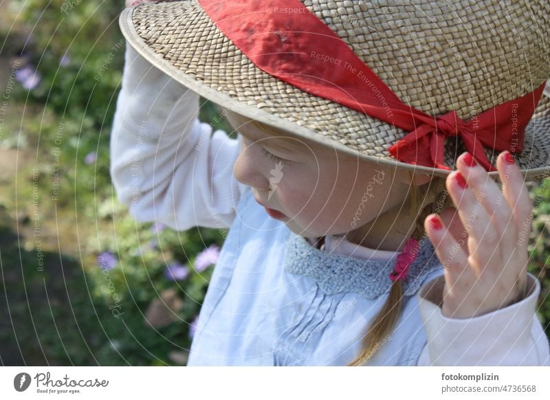 Girl with hat Child Hat Girlish Toddler Infancy Summery Spring Spring fever Small Face out Exterior shot Rural Playing portrait pretty Cheerful Head Downward