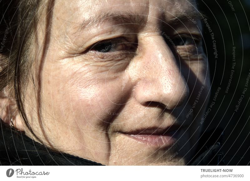 Face of experienced, profound woman and brave warrior, portrait of woman very close and in sunlight Woman Head Near Close-up Sunlight Shadow eyes Nose Mouth