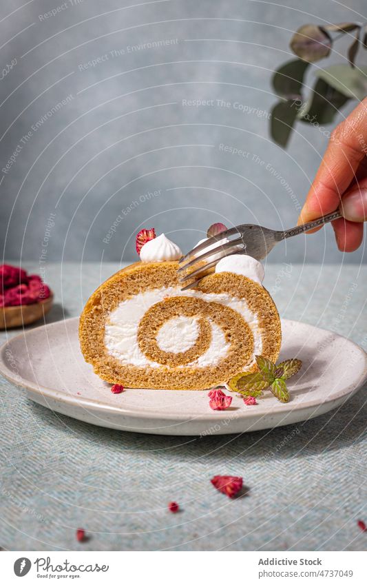 Person with fork taking piece of sweet roll person cream appetizing eat pastry dessert baked tasty plate delicious dried whipped raspberry yummy table topping