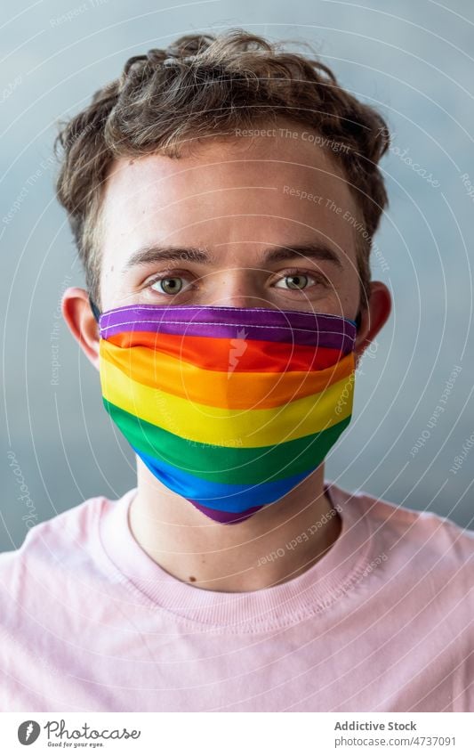 Man in LGBT medical mask man transgender lgbt pandemic symbol identity unconventional safety equal respect activism rainbow coronavirus new normal covid 19