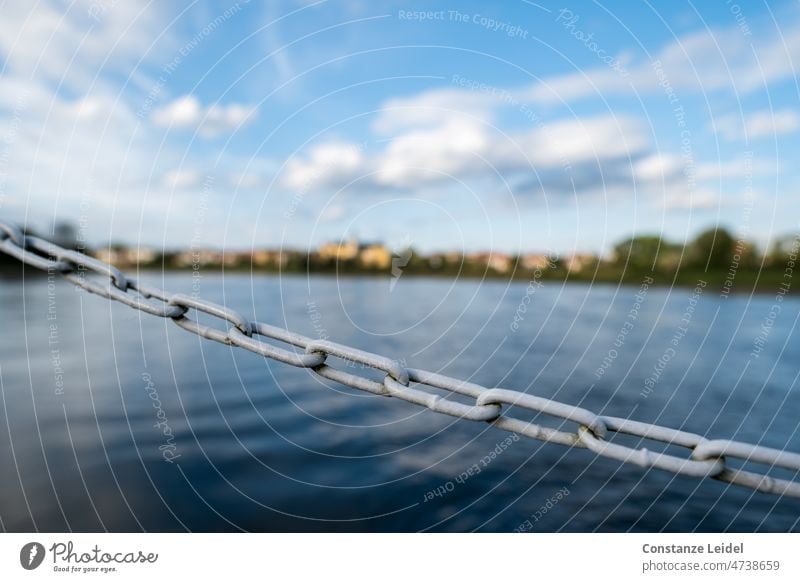 Barrier chain from water and sky Water Lake River Sky Chain Shut-off chain Blue Clouds Clouds in the sky blurriness Ferry Nature Deserted Calm Surface of water