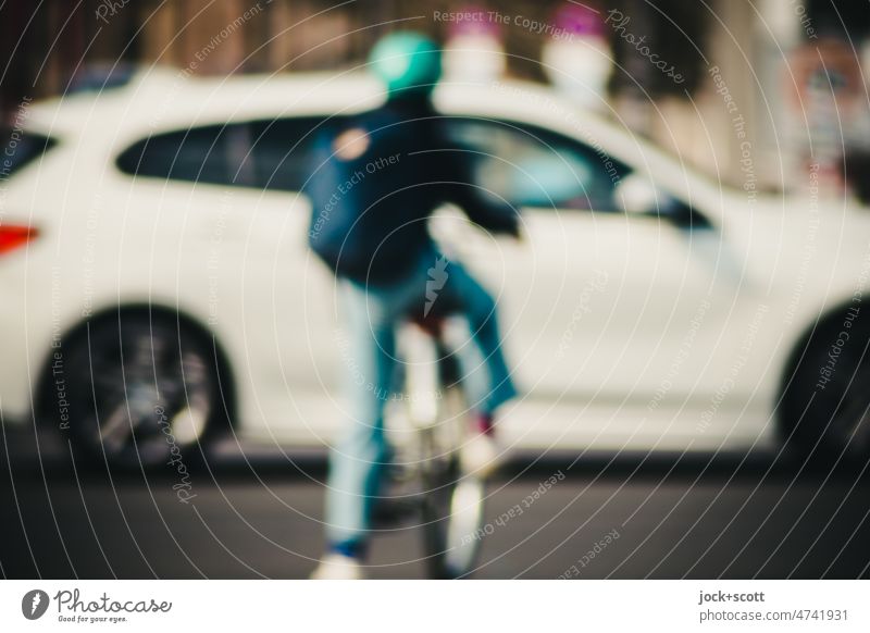 Bicyclist wants to cross a road busy with cars defocused Bicycle Lifestyle Transport Human being Wait Driving Traverse Means of transport Road traffic